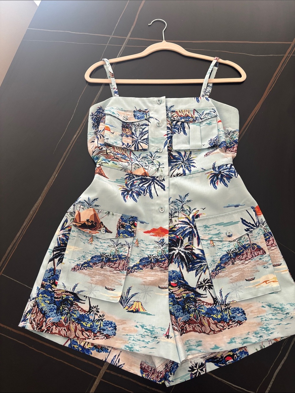 Tropical Print Button-Front Romper in Light blue.